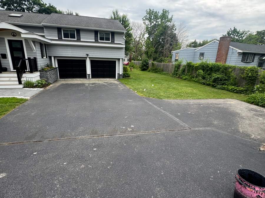 Residential asphalt before sealcoating and crack filling